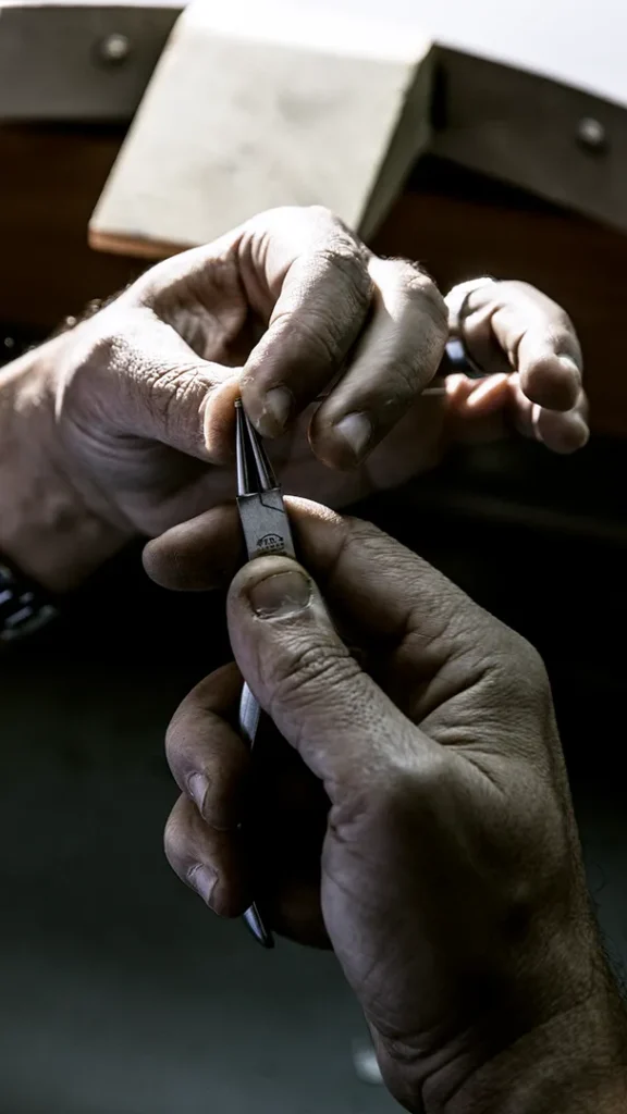 Close up on hands working on detail work