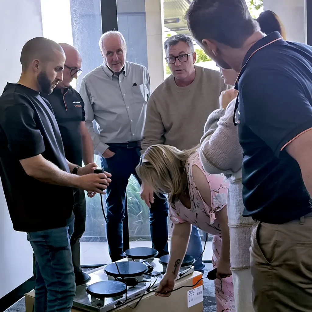 Haus Group staff checking out Pitt Cooking induction cooktops